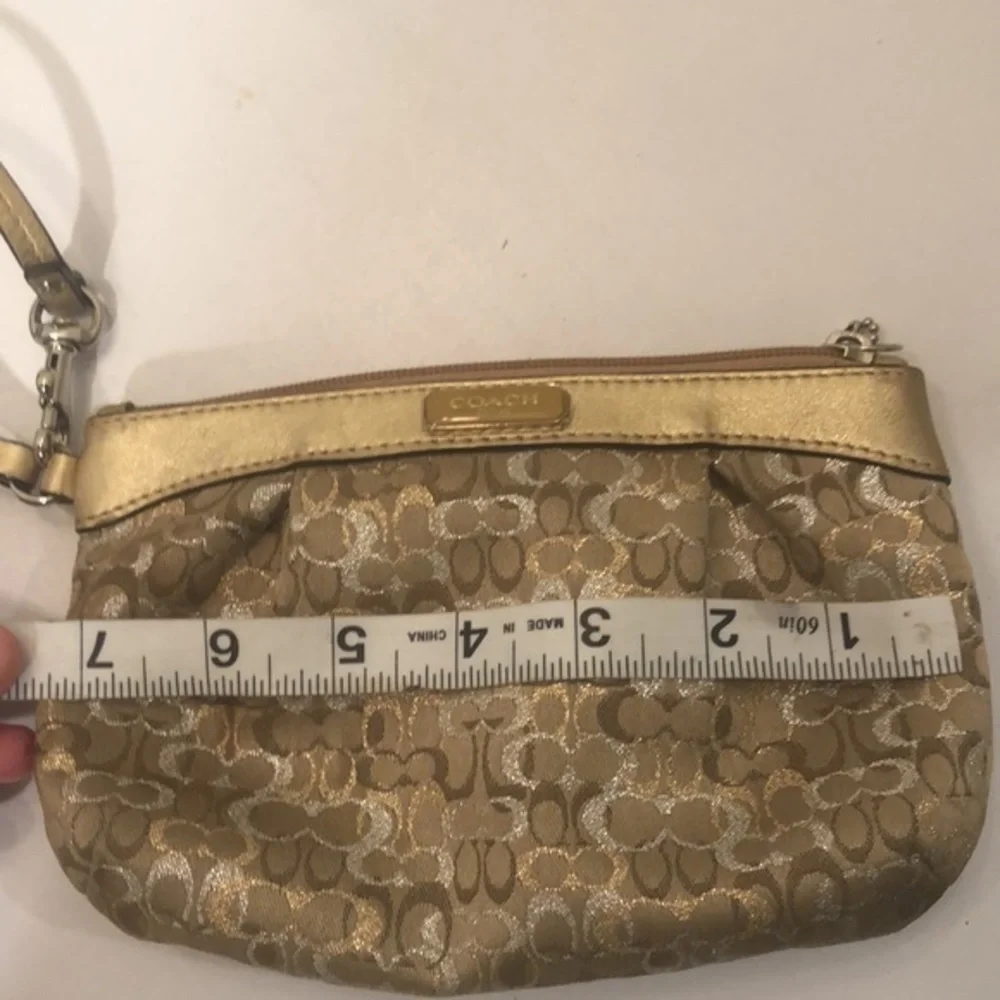 Coach gold optic wristlet